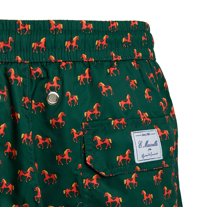 Close-up of the personalized label on the back of the Luciano De Crescenzo dark green swimsuit.