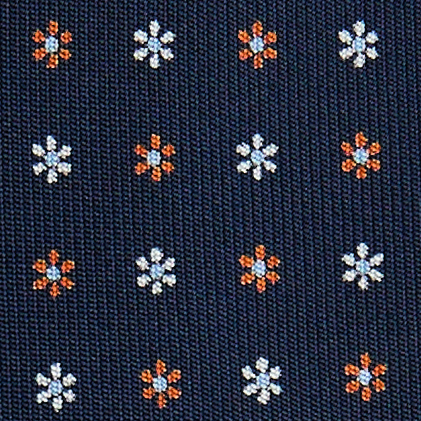dark_blue_5_fold_sartorial_silk_tie_small_flower_pattern_fabric_pattern_detail
