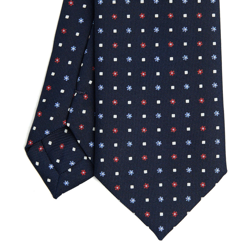 dark_blue_sartorial_7_cm_silk_tie_small_flower_pattern_tip_detail