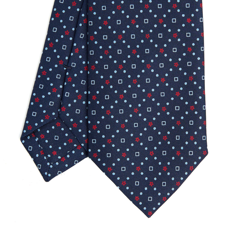 dark_blue_sartorial_7_cm_silk_tie_small_flower_pattern_tip_detail