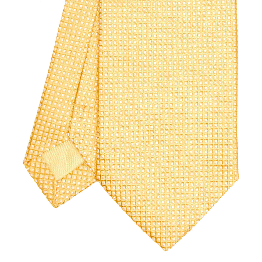 yellow_ceremonial_jacquard_silk_tie_small_geometric_pattern_tip_detail