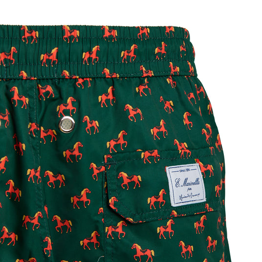 Close-up of the personalized label on the back of the Luciano De Crescenzo dark green swimsuit.