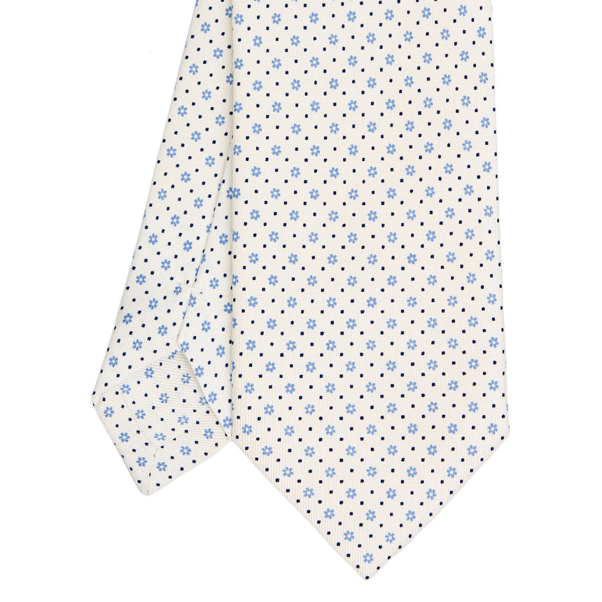 white_sartorial_classic_silk_tie_small_flower_pattern_tip_detail