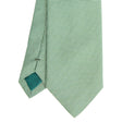 dark_green_ceremonial_jacquard_silk_tie_small_geometric_pattern_tip_detail