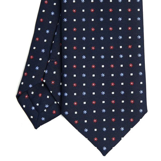dark_blue_sartorial_7_cm_silk_tie_small_flower_pattern_tip_detail