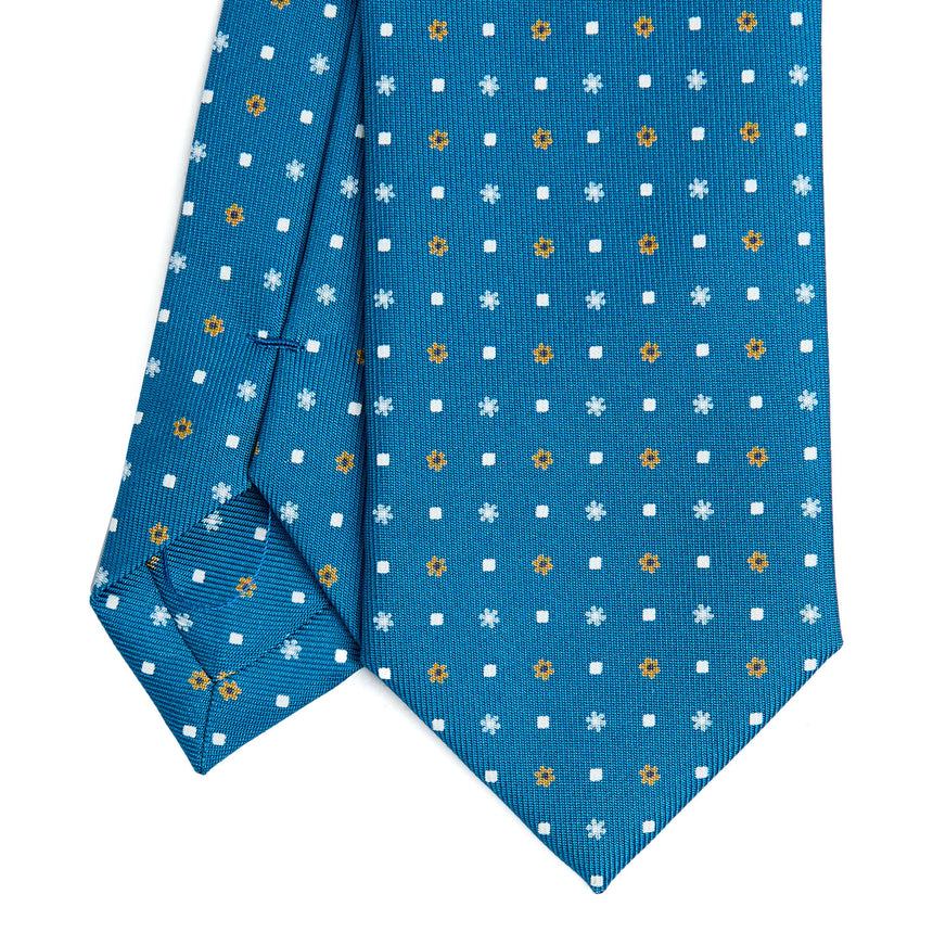 mid_blue_sartorial_7_cm_silk_tie_small_flower_pattern_tip_detail