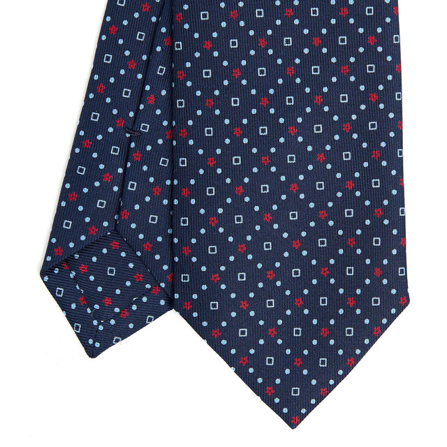 dark_blue_sartorial_7_cm_silk_tie_small_flower_pattern_tip_detail