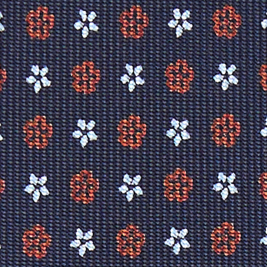 dark_blue_9_fold_sartorial_silk_tie_small_flower_pattern_fabric_pattern_detail