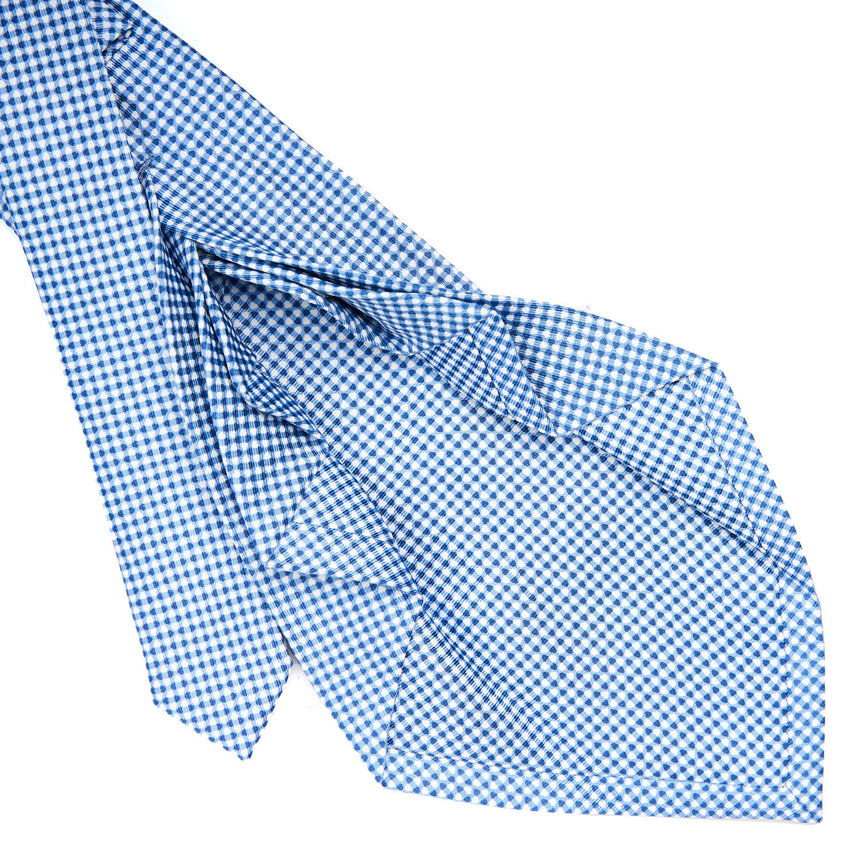 light_blue_9_fold_sartorial_silk_tie_small_flower_pattern_detail_of_the_back_pleats