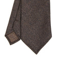 dark_brown_classic_unlined_wool_tie_solid_color_tip_detail